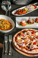 Pizza, Chicken Tandoori, Chicken briyani, Indian and Italian famous cuisine