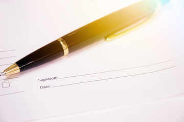 The pen is based on business papers for signing. Sunlight.