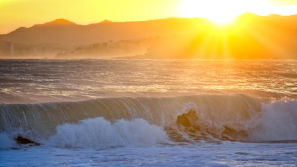 Beautiful sunset in Spain with big waves, Costa Brava