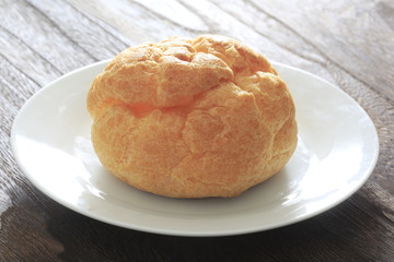 Cream puff on a white dish