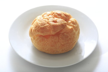 Cream puff on a white dish