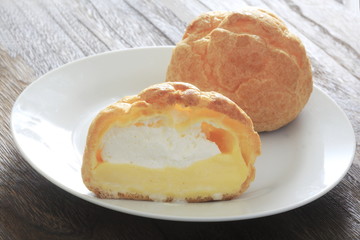 Cream puff on a white dish