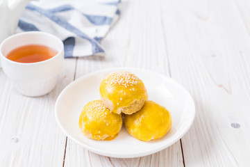 Chinese pastry or moon cake filled with mung bean paste and salted egg yolk