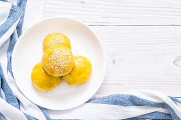 Chinese pastry or moon cake filled with mung bean paste and salted egg yolk