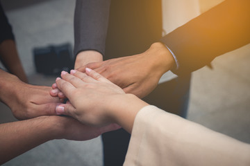 business team work concept : business people hold hand together ,professional agreement partnership community