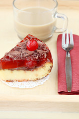 served romantic breakfast for lover: cup of coffee with milk and fresh baked delicious cherry cheese cake