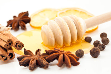  Honey with spices on a white background closeup