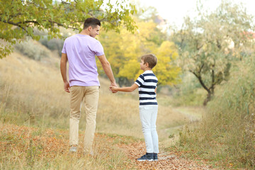 Father and his son in countryside