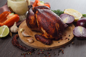 roasted chicken on wooden background