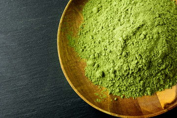 Japanese green tea matcha in a wooden bowl