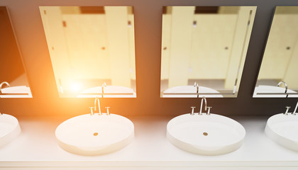 Wash basins in the public restroom. 3D rendering. Sunset
