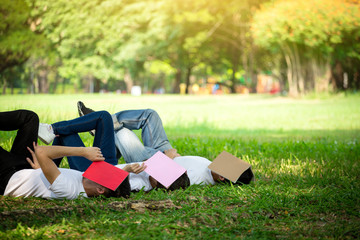 Group of peoples sleep with book on face because of study hard