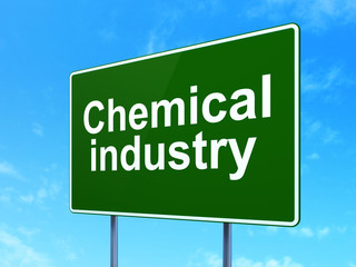 Manufacuring concept: Chemical Industry on green road highway sign, clear blue sky background, 3D rendering