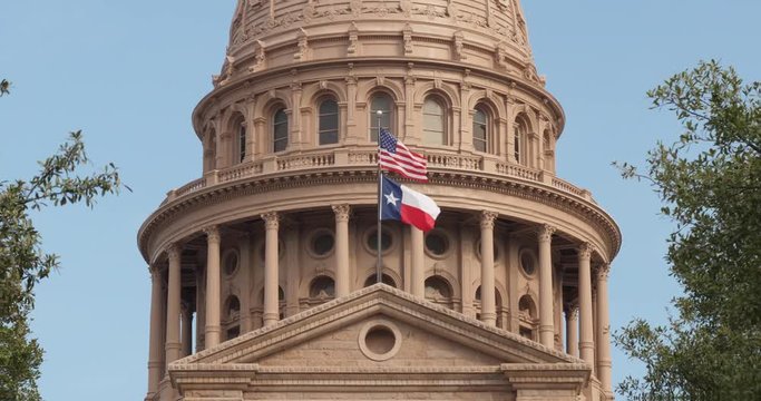 A closeup daytime exterior (DX) view of the Texas state capitol dome in downtown Austin, Texas. Day/night matching available.  	