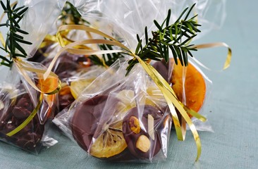 Wrapping handmade chocolate candies in cellophane bags for the holidays 