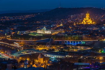 TBILISI, GEORGIA - DEC.12, 2017 : Holy Trinity Cathedral of Tbilisi at dusk view from the hill
