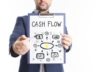 The concept of business, technology, the Internet and the network. A young businessman shows a successful scheme of work: Cash flow