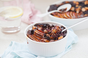 Vegan baked oatmeal crumble with apple, blueberry, Brazil nut and date syrup