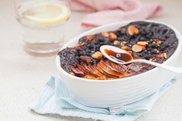 Vegan baked oatmeal crumble with apple, blueberry, Brazil nut and date syrup