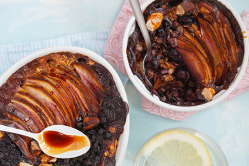 Vegan baked oatmeal crumble with apple, blueberry, Brazil nut and date syrup, top view