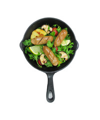 chicken sausage and salad  decorate with lemon, tomato, potato, vegetable, mushroom. Every thing on black pan. In kitchen room or restaurant.