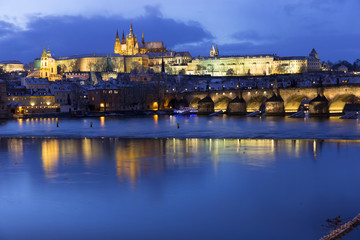 Christmas night snowy Prague Lesser Town with Charles Bridge and Prague Castle, Czech republic