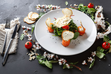 Restaurant dish on white plate on black background