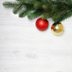 Christmas and New Year's composition. The pine cones, spruce branches on a wooden white background