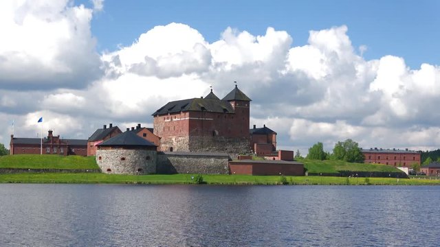 View on the castle in Hameenlinna with the lake Vanajavesi, june day. Finland