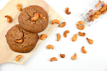 Cashews cookie on wooden boards and white background.