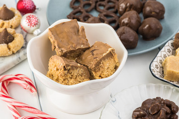 Homemade chocolate candies and cookies for Christmas party table.