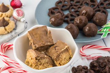 Homemade chocolate candies and cookies for Christmas party table.