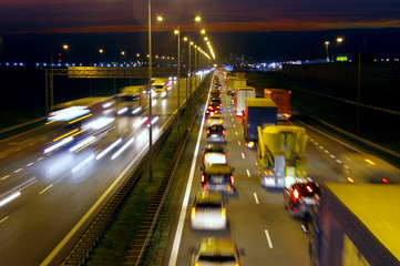 Fototapeta na wymiar Highway traffic by night