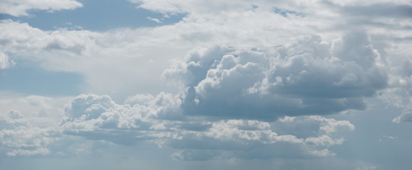 Fototapeta na wymiar cloudscape. white cumulus clouds on a light blue sky background