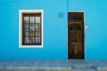 Bright Blue House with Brown Door