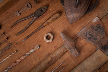 Collection of vintage tools on wooden background