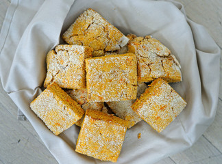 Basket of square sweet potato scones with sugar on top 