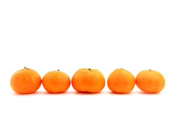 Small honey tangerines shot over white background