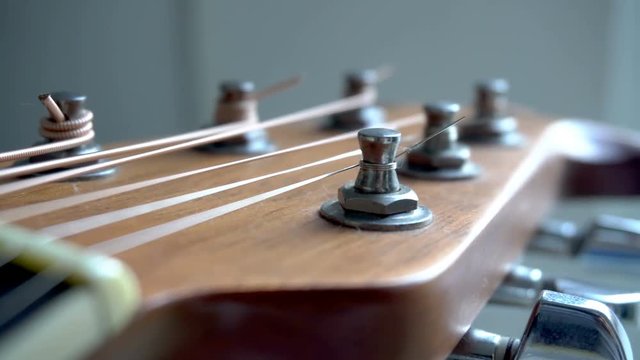 Acoustic guitar tuning pegs with strings
