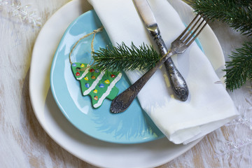 Festive table setting for Christmas dinner on whitw wooden table angelsbackgroundboxbranchbrushcelebrationchocolatechristmaschristmas backgroundchristmas magicchristmas treeclayclose upcongratulations