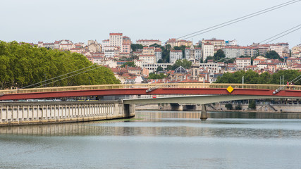 Vieux-Lyon, colorful houses and footbridge in the center, on the river Saone 

