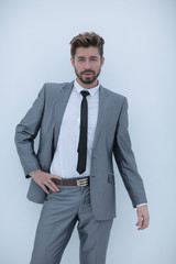 serious businessman with hands on hips, isolated background