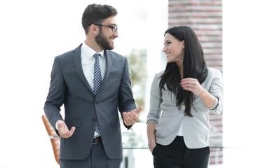 employees of the company discuss working issues standing in the office
