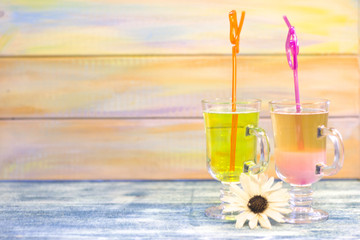 Tropical cocktails with bright straws