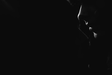 Beautiful girl. A model in a stylish wide-brimmed hat at a pedestrian crossing. Harmoniously similar clothes in gray tones. Street style shooting. Women's fashion.