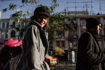 Beautiful couple in stylish clothes in gray tones, city