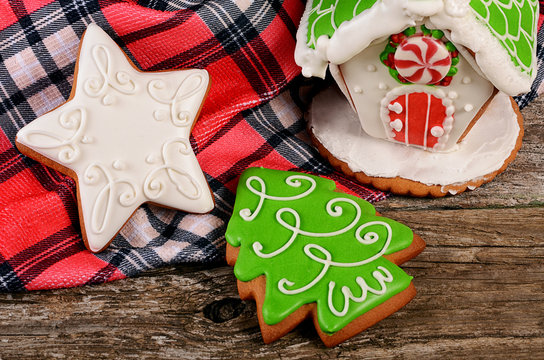 Gingerbread house on wooden background