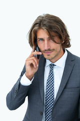 young man listening on a phone on a white background