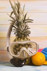 Funny pineapple in a swimming mask