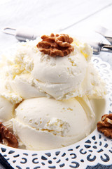 homemade oatmeal and walnut ice cream on wooden background